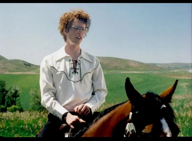 Napoleon Dynamite riding a horse